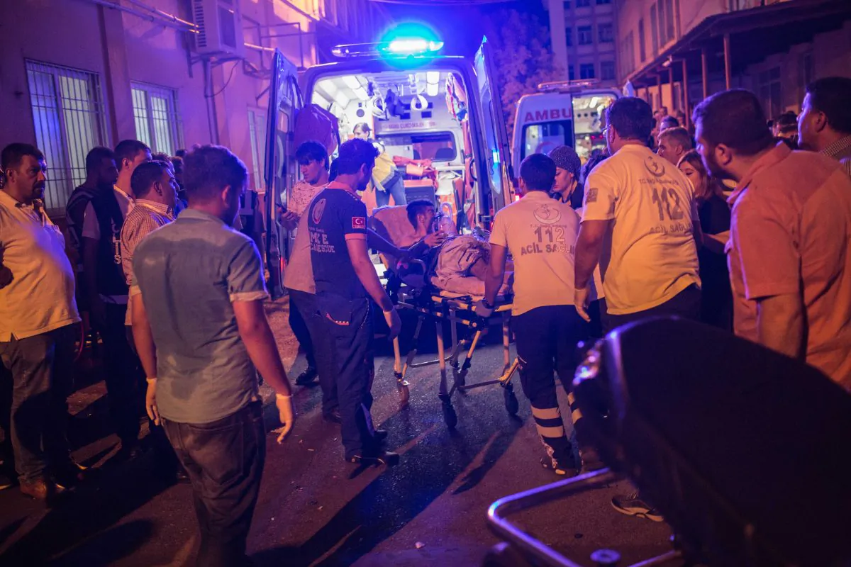 First aid officers carry an injured man to hospital in Gaziantep on Aug. 20, 2016, following a late night militant attack on a wedding party in southeastern Turkey. (Ahmed Deeb/AFP/Getty Images)