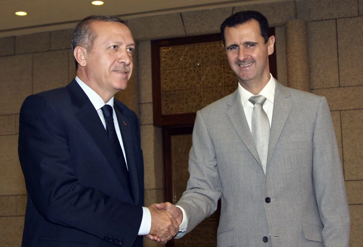 Syrian President Bashar Assad (R) shakes hands with then Turkish Prime Minister Recep Tayyip Erdogan, at Al-Shaab presidential palace in Damascus, Syria, on Oct. 11, 2010. (Bassem Tellawi/AP Photo)