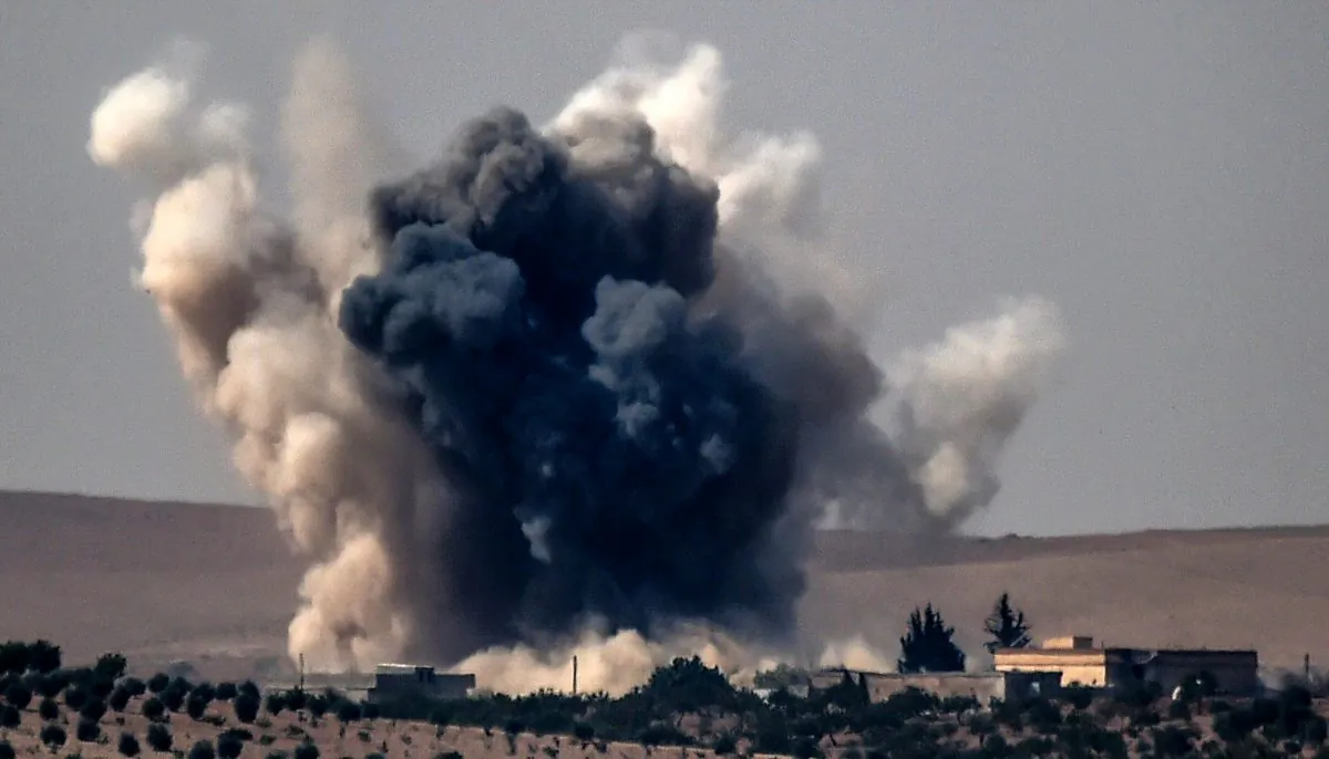 Stock photo of smoke billows following air strikes. (Bulent Kilic/AFP/Getty Images)