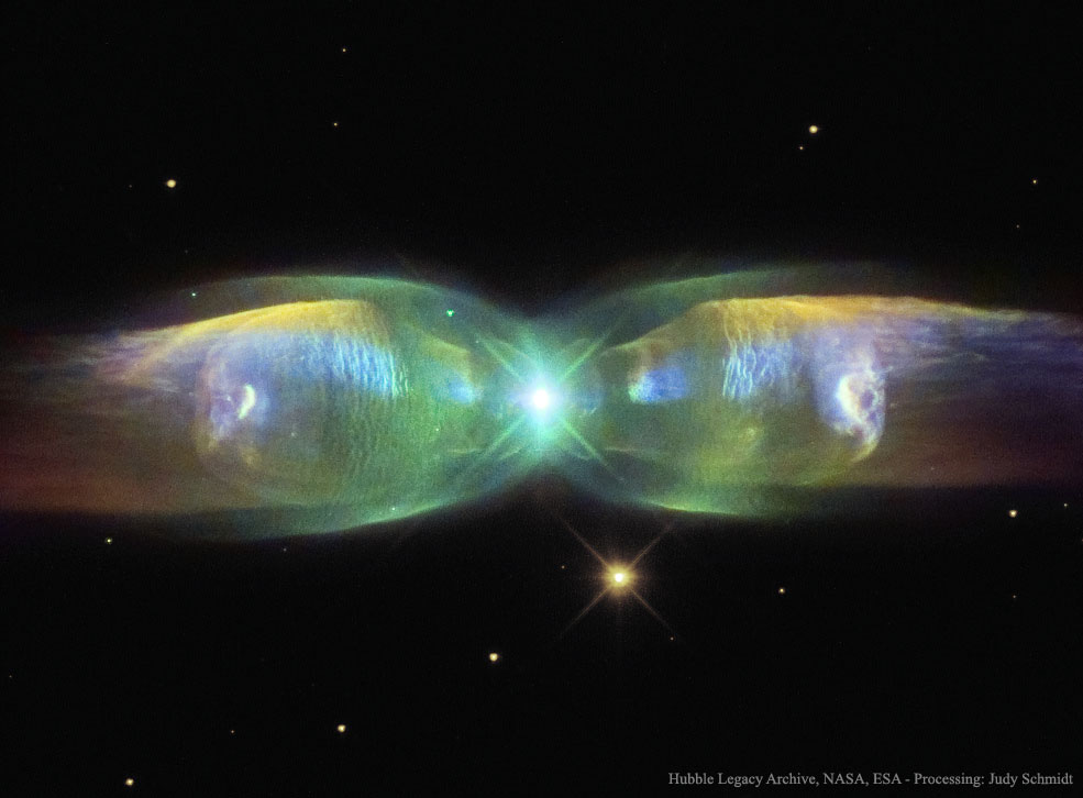 The M2-9 butterfly planetary nebula 2,100 light-years away shows the beauty of dying stars. In the center, two stars orbit inside a gaseous disk 10 times the orbit of Pluto. The expelled envelope of the dying star breaks out from the disk creating the bipolar appearance. Much remains unknown about the physical processes that cause planetary nebulae. (Hubble Legacy Archive, NASA, ESA, Processing: Judy Schmidt)