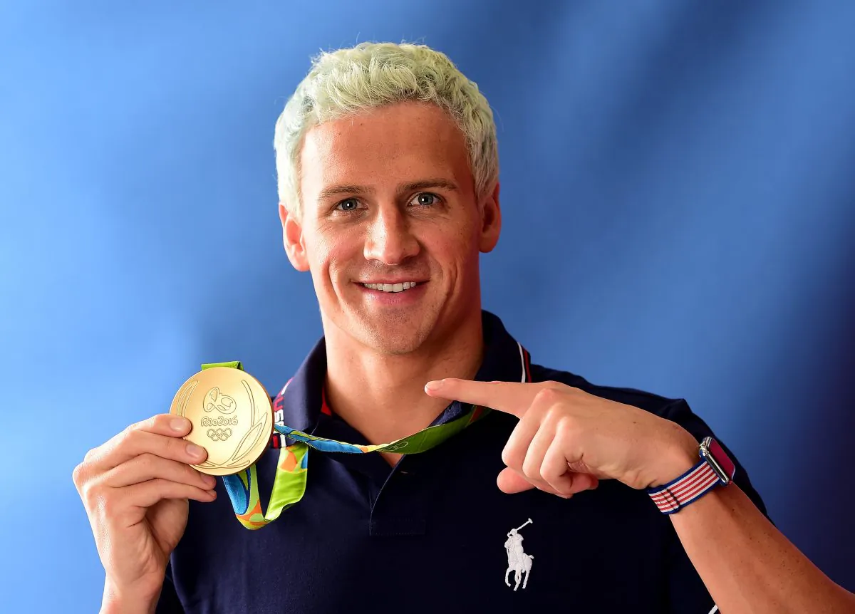 Swimmer, Ryan Lochte of the United States poses for a photo with his gold medal on the Today show set on Copacabana Beach in Rio de Janeiro, Brazil on Aug. 12, 2016. (Harry How/Getty Images)