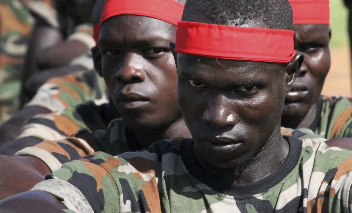 A group of government soldiers wait in line during a military parade celebrating the national army in Juba, South Sudan, on May 16, 2016. (AP Photo/Justin Lynch)