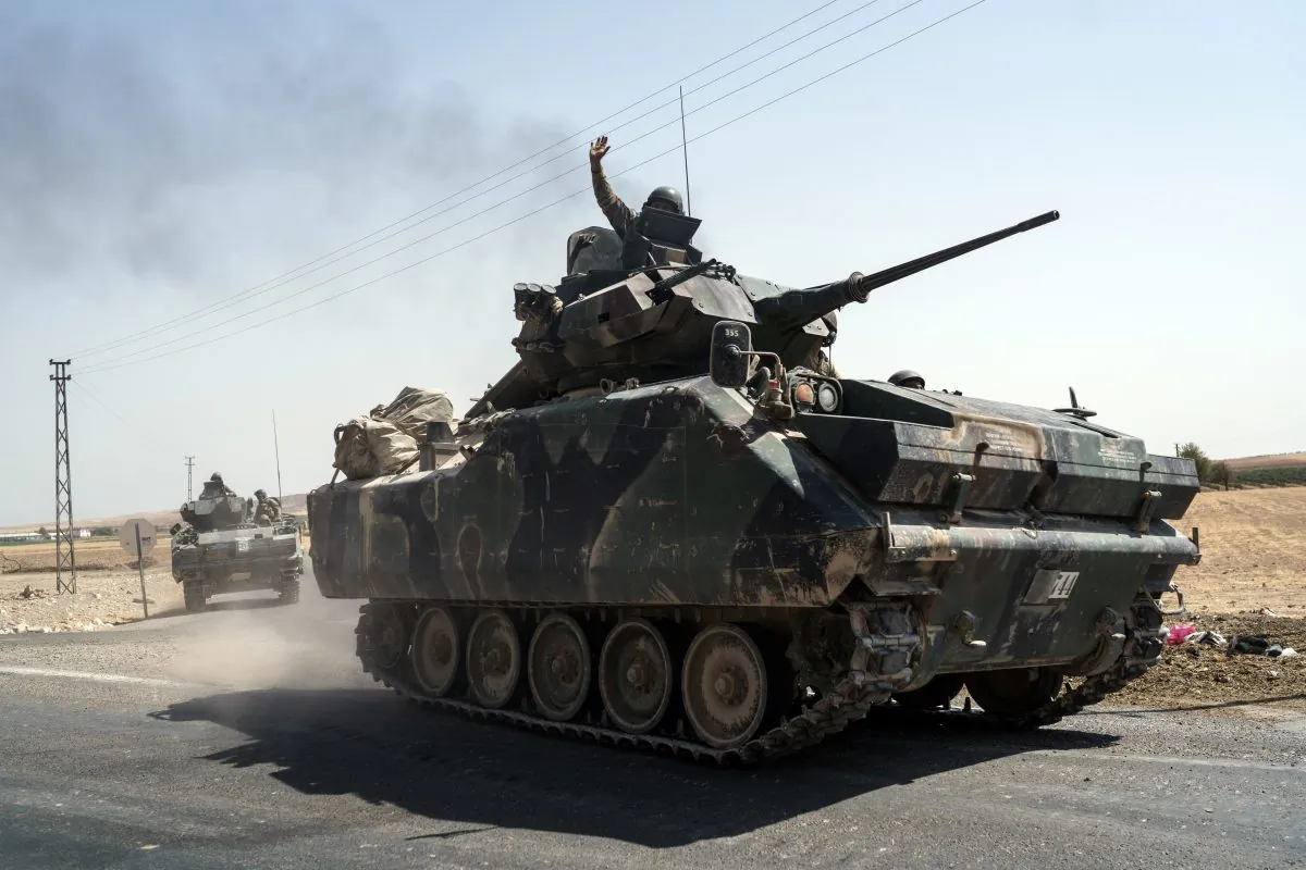 Turkish troops head to the Syrian border, in Karkamis, Turkey, on Aug. 27, 2016. (AP Photo/Halit Onur Sandal)