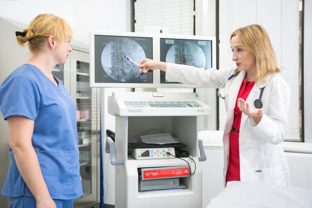 Dr. Mila Mogilevsky (R) and staff member of Unique Pain Medicine in New York on Aug. 1, 2016. (Benjamin Chasteen/Epoch Times)