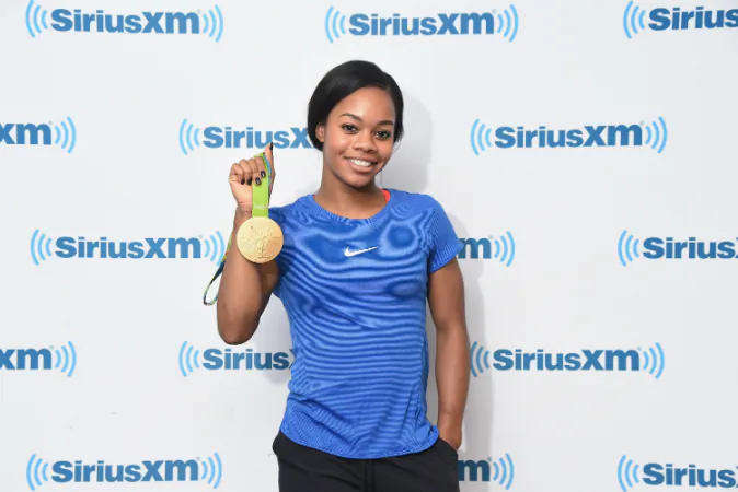 Gymnast Gabby Douglas visits SiriusXM Studios on August 24, 2016 in New York City. Douglas was recently hospitalized for a mouth infection on
(Photo by Michael Loccisano/Getty Images)