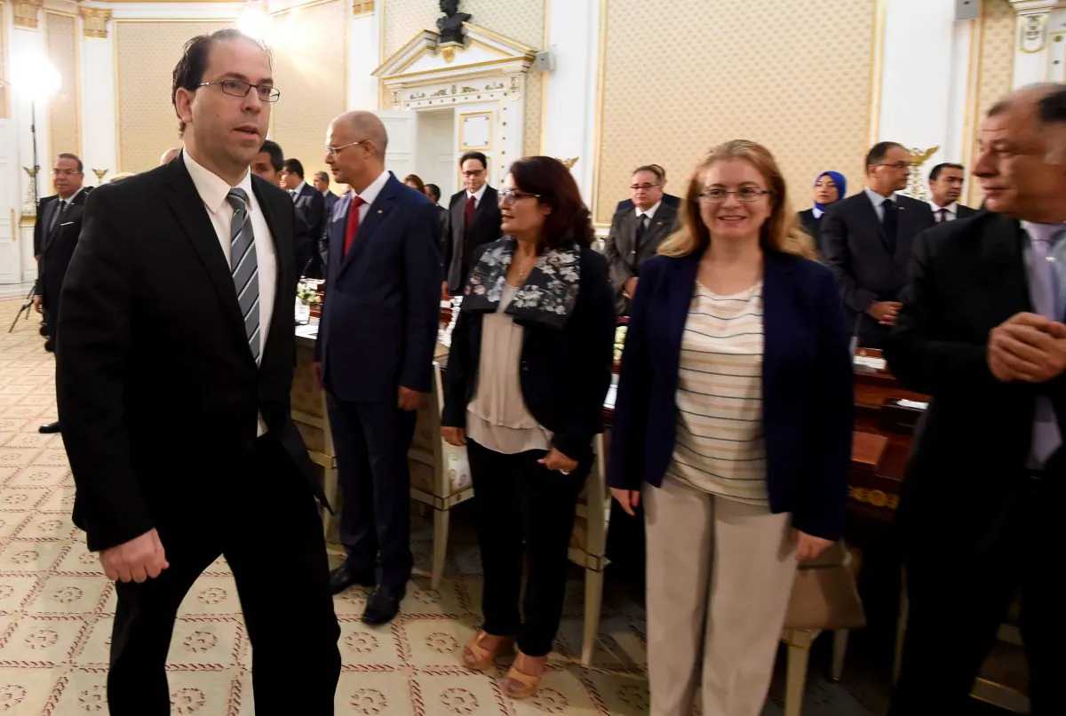 Tunisia's new Prime Minister Youssef Chahed (L) arrives for his first cabinet meeting on August 31, 2016 at the Carthage Palace near Tunis. (FETHI BELAID/AFP/Getty Images)