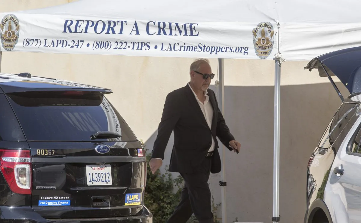 Chris Brown's attorney Mark Geragos leaves Brown's house in the Tarzana neighborhood of Los Angeles, on Aug. 30, 2016. (Damian Dovarganes/AP Photo)