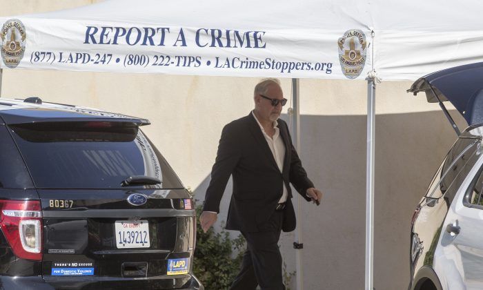 Chris Brown's attorney Mark Geragos leaves Brown's house in the Tarzana neighborhood of Los Angeles, on Aug. 30, 2016. (Damian Dovarganes/AP Photo)