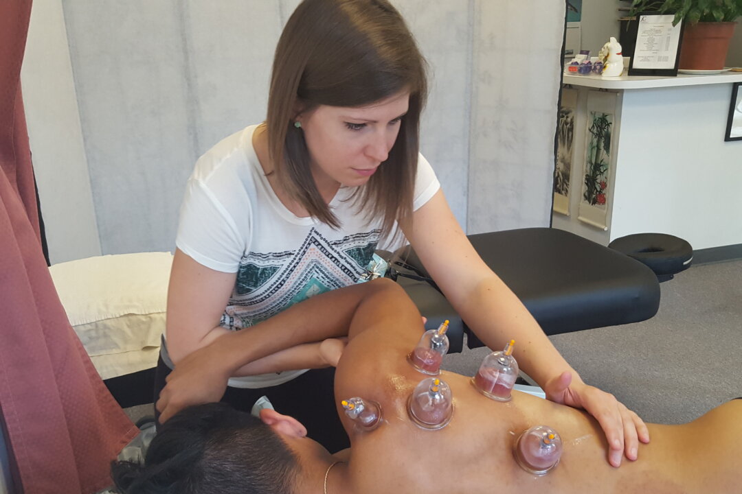 Physical therapist Rebecca Young does myofascial decompression treatment on a patient. (Karena Wu/ ActiveCare Physical Therapy)