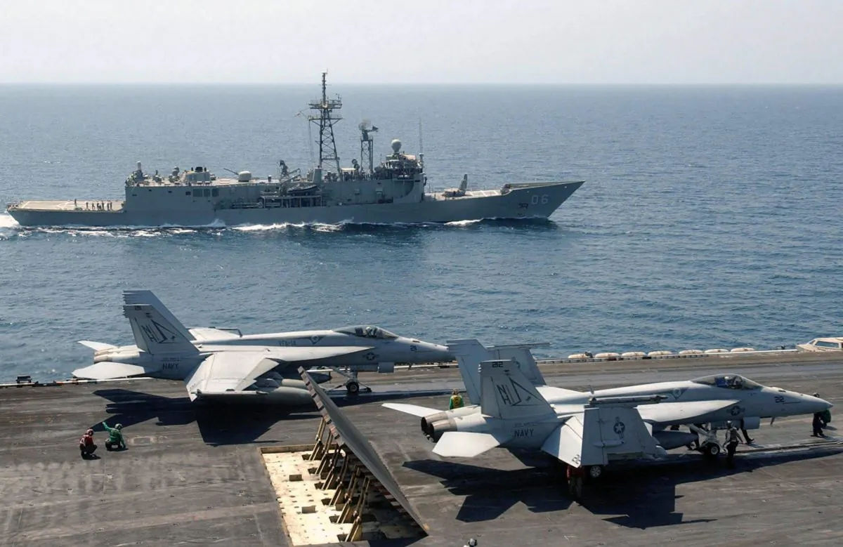 A frigate of the Royal Australian Navy at sea with the USS Nimitz aircraft carrier in 2005. (US Navy)