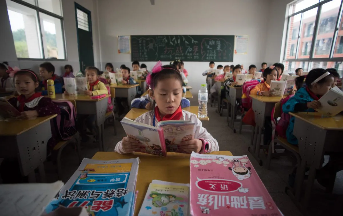 Chinese schoolchildren attended class at the Shiniuzhai Puan Center Primary School in Pingjiang County in China's Hunan Province, on Oct. 8, 2015. (Johannes Eisele/AFP/Getty Images)