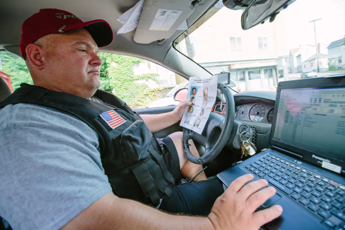 On July 5, 2016, Sgt. Doug Clarke, from the Allegheny County Sheriff's Department, logs locations the deputies visit each day, noting where they found fugitives and where they struck out. A Post-Gazette review of records from some of the country's largest counties found that it often takes officials months to track down violators. (Andrew Rush/Post-Gazette via AP)