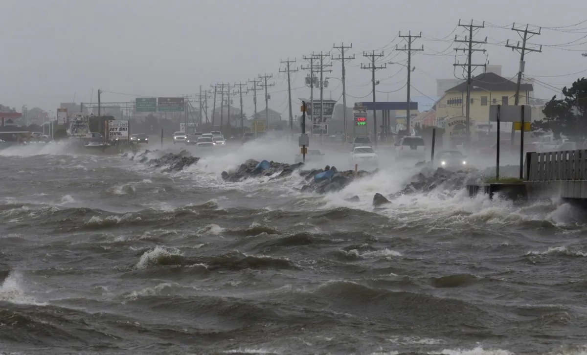 Water from Roanoke Sound pounds the Virginia Dare Trail in Manteo, N.C., on Sept. 3, 2016 as Tropical Storm Hermine passes the Outer Banks. (AP Photo/Tom Copeland)