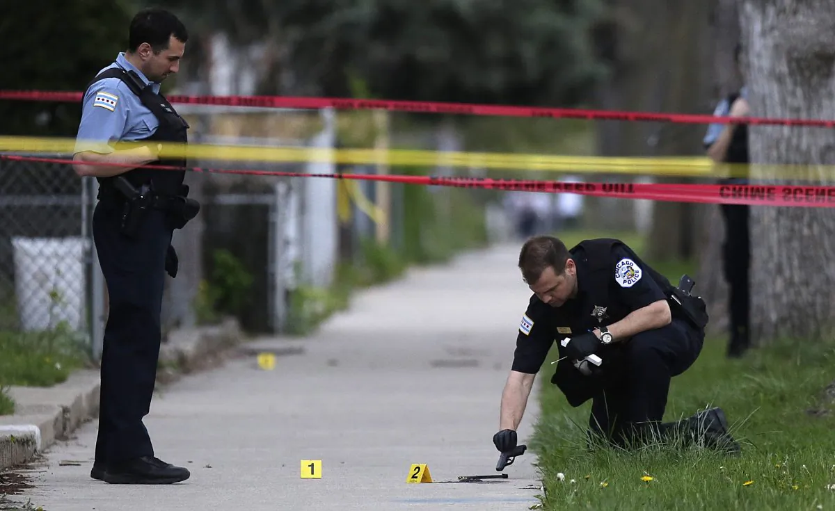 Police investigate a shooting in Chicago, Ill., in a file photograph. (Joshua Lott/Getty Images)