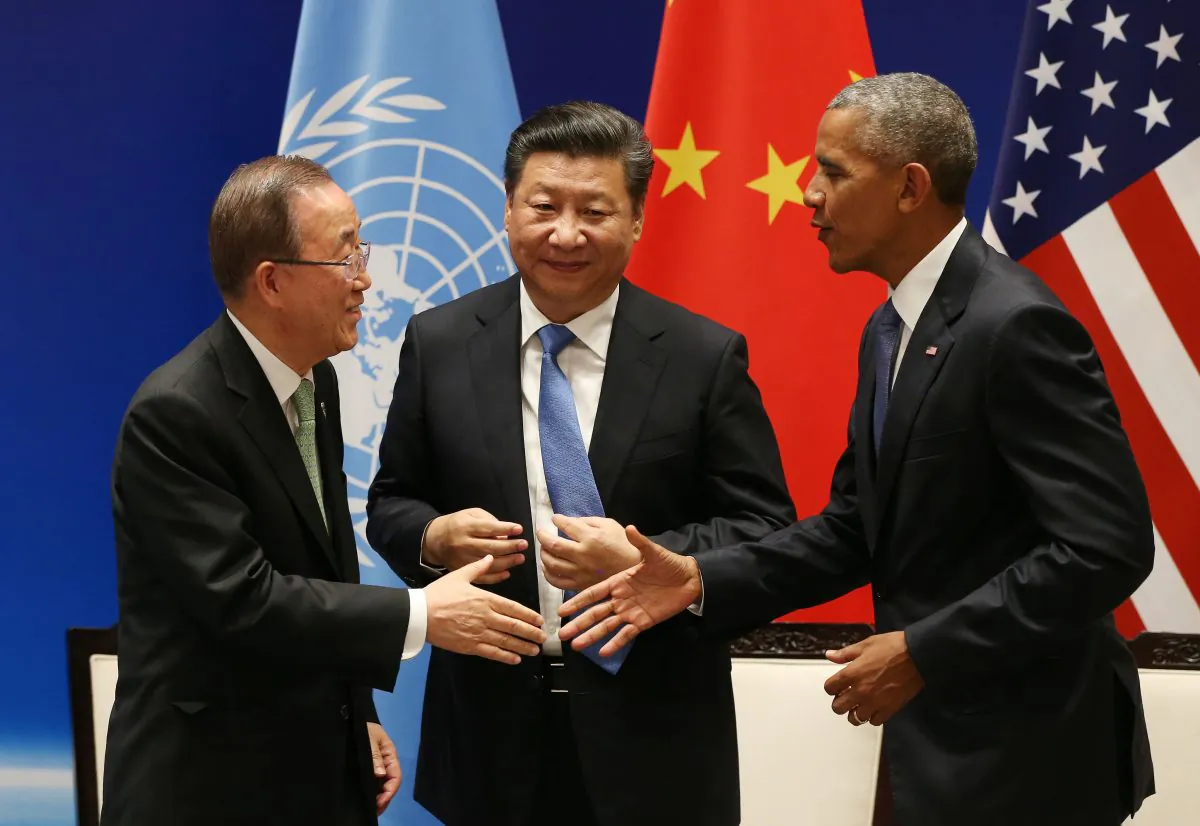 Chinese leader Xi Jinping (C) with U.S. President Barack Obama (R) and U.N. Secretary-General Ban Ki-moon during a joint ratification of the Paris climate change agreement at the West Lake State Guest House in Hangzhou on Sept. 3, 2016. (How Hwee Young/AFP/Getty Images)