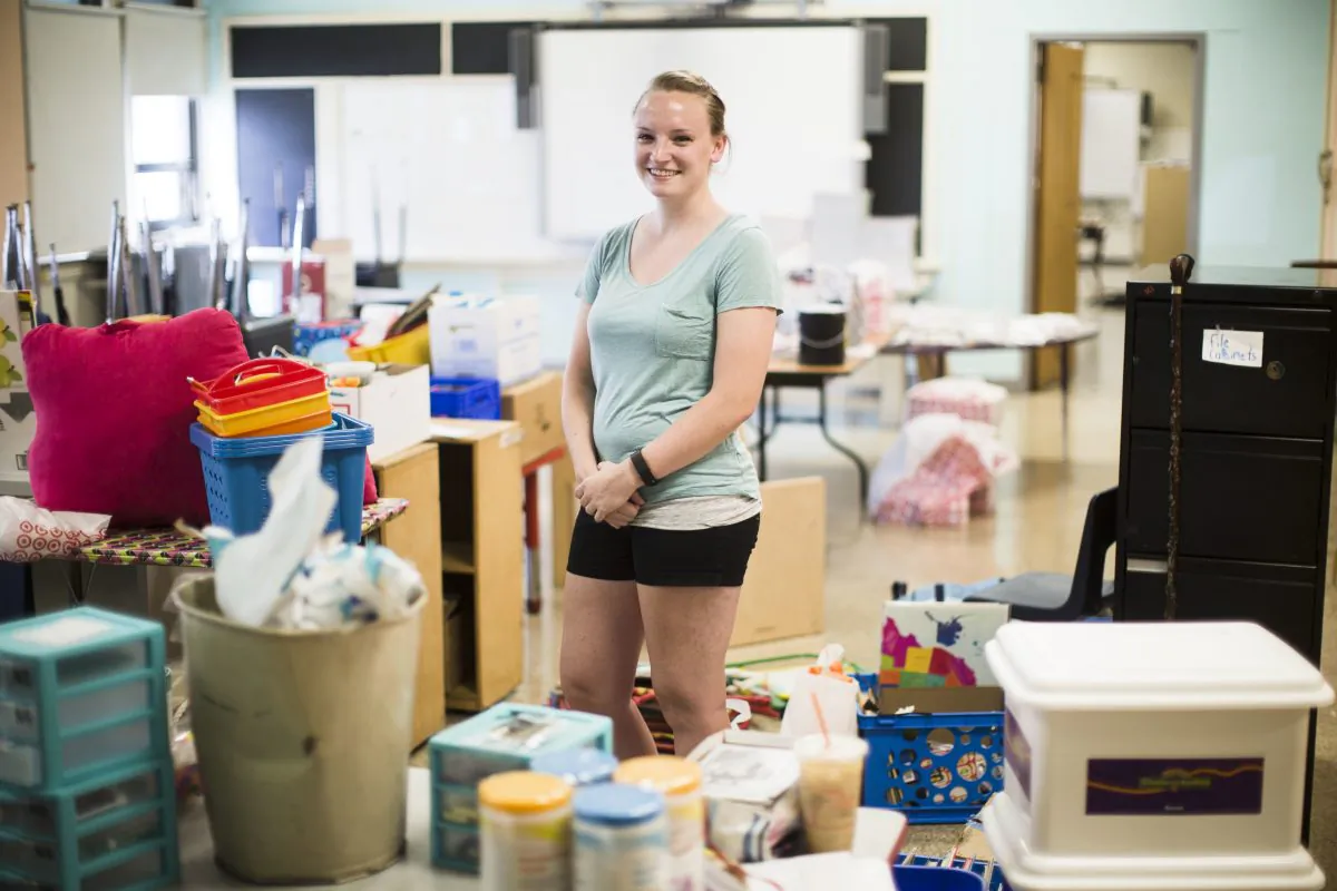 Kindergarten school teacher Shannon Raftery poses for a photograph in her classroom as she prepares it for the upcoming school year in Philadelphia on Aug. 31, 2016. Raftery raised funds through crowdfunding to supplement the money she took out of each paycheck to pay for classroom supplies. (AP Photo/Matt Rourke)