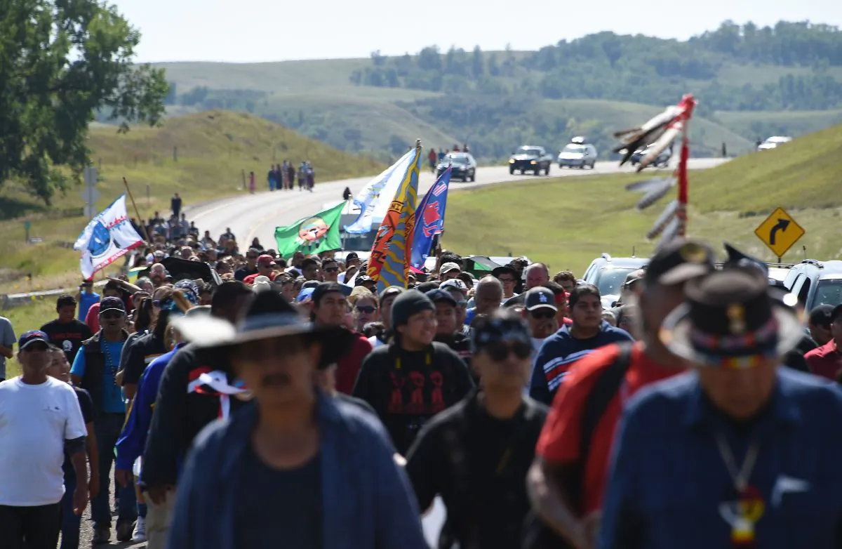 Protestors march to a construction site for the Dakota Access Pipeline to express their opposition to the pipeline, at an encampment where hundreds of people have gathered to join the Standing Rock Sioux Tribe's to protest against the construction of the new oil pipeline, near Cannon Ball, North Dakota, on Sept. 3, 2016. (Robyn Beck/AFP/Getty Images)