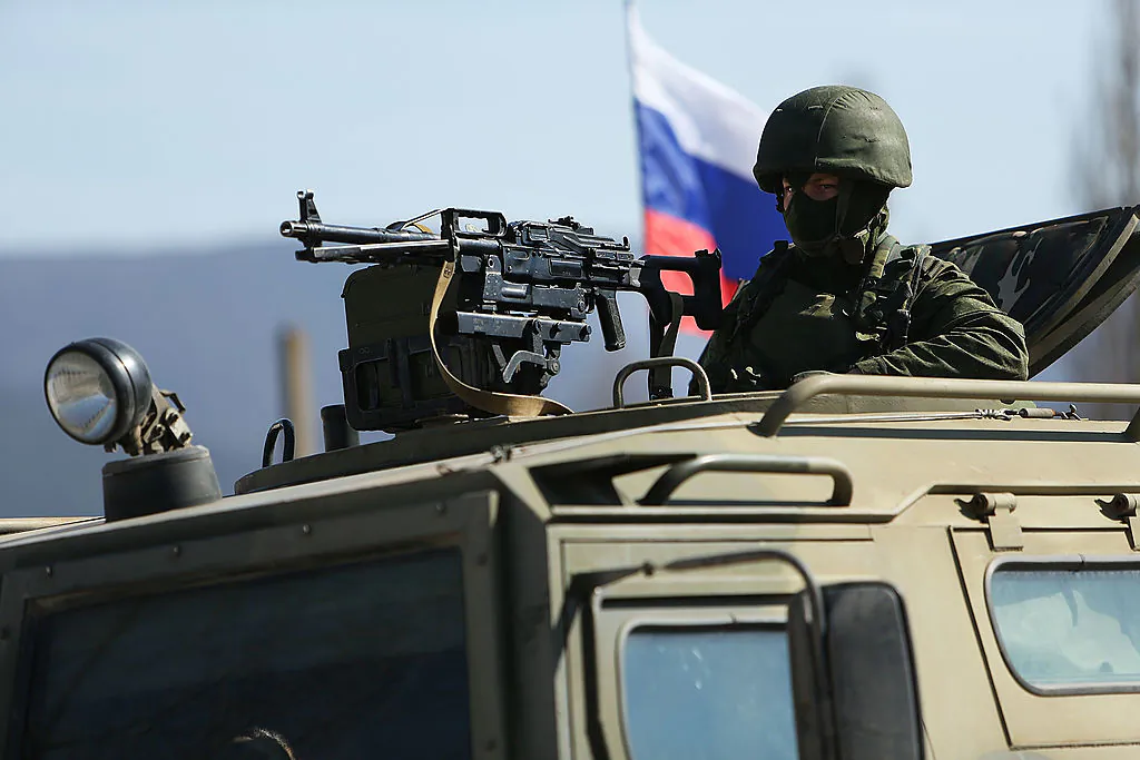 PEREVEVALNE, UKRAINE - MARCH 11: Russian paramilitaries stand guard outside of a Ukrainian military base in the town of Perevevalne near the Crimean city of Simferopol on March 11, 2014 in Perevevalne, Ukraine. As the standoff between the Russian military and Ukrainian forces continues in Ukraine's Crimean peninsula, world leaders are pushing for a diplomatic solution to the escalating situation. Crimean citizens will vote in a referendum tomorrow on whether to become part of the Russian federation. (Photo by Spencer Platt/Getty Images)