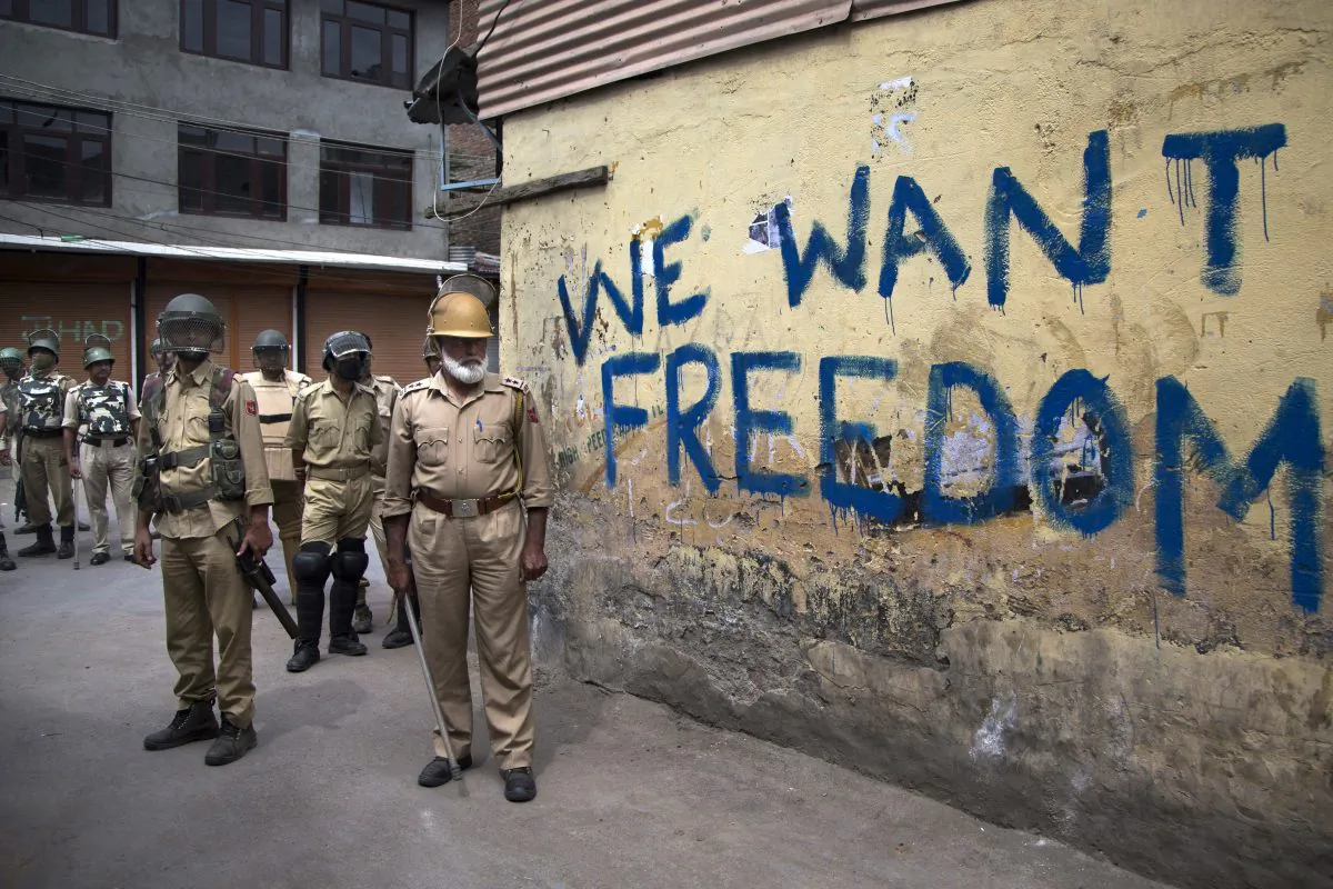 Indian policemen stand guard during a curfew in Srinagar, Indian-controlled Kashmir, on Aug. 12, 2016. (AP Photo/Dar Yasin)