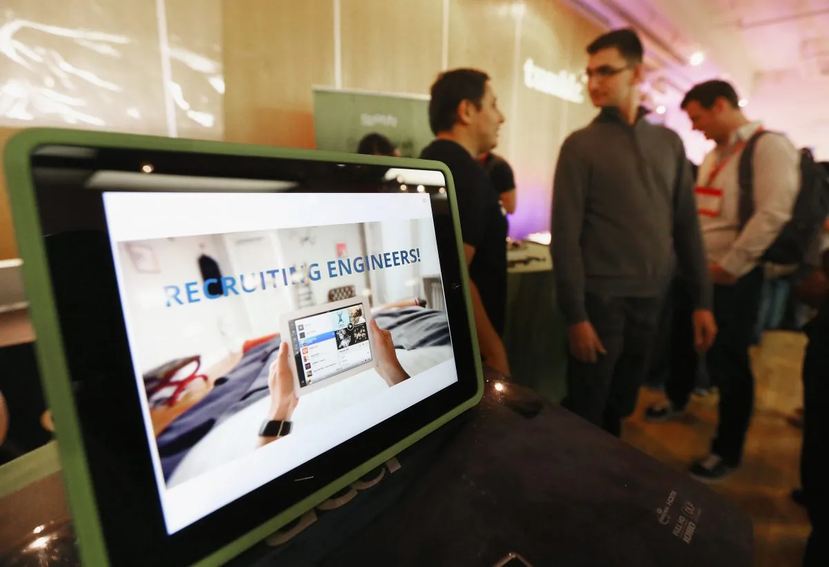 People attend a tech recruiting event in New York City, May 17, 2013. (Mario Tama/Getty Images)