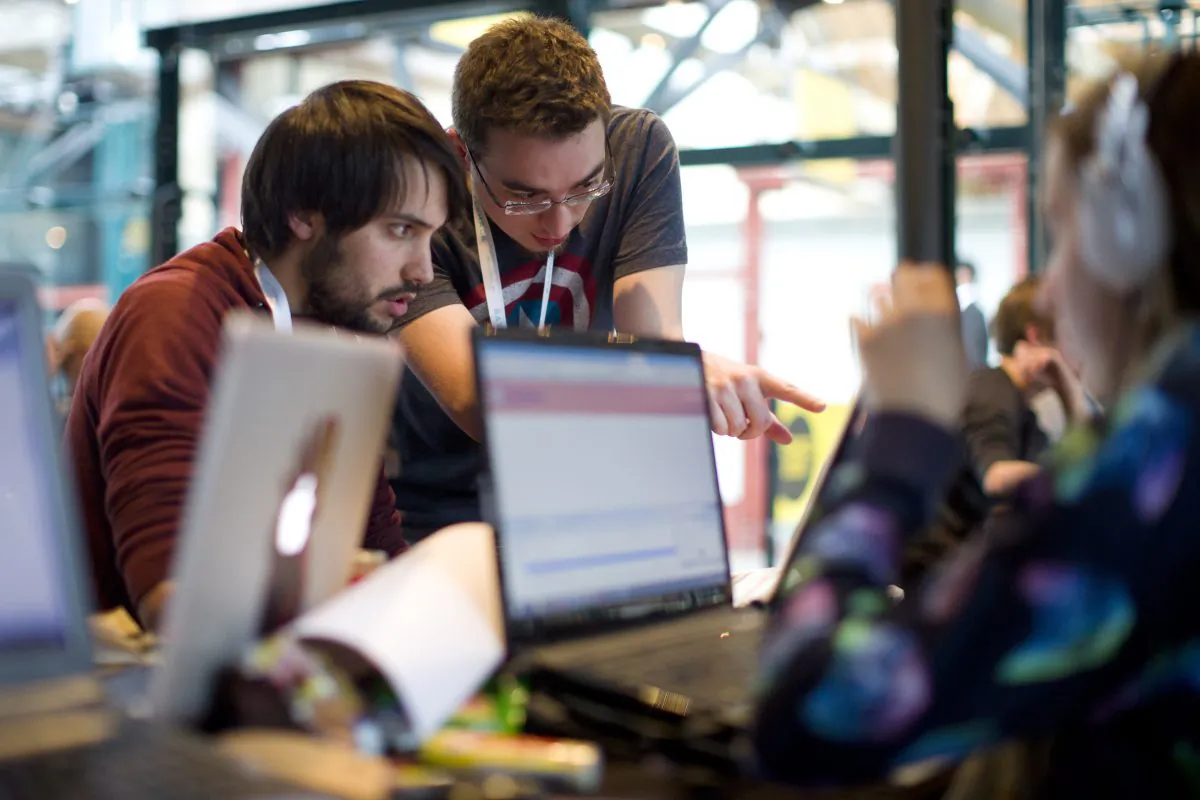 Users around a computer in London, UK. (Justin Tallis/AFP/Getty Images)