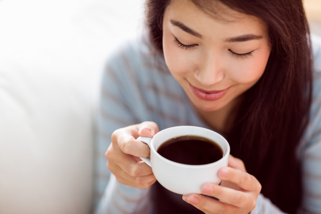 Lady drinking black tea (wavebreakmedia/shutterstock)