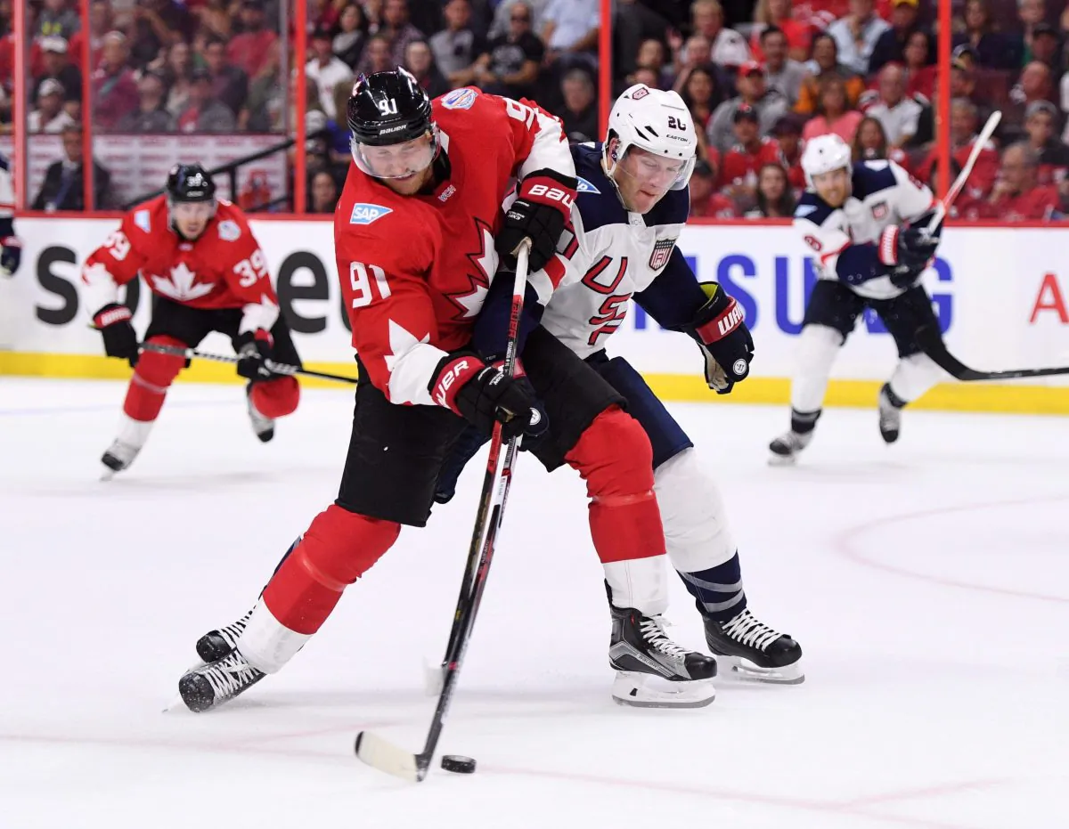 Team Canada’s Steven Stamkos fights to hold on to the puck against Team USA's Ryan Suter in pre-tournament World Cup of Hockey action in Ottawa on Sept. 10, 2016. (The Canadian Press/Sean Kilpatrick)