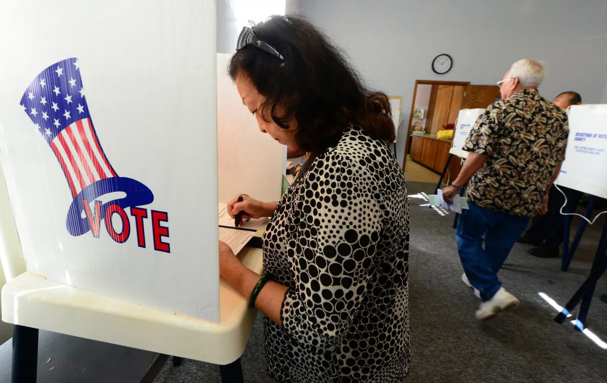 Robena Cheung votes at a polling station  in Monterey Park, Los Angeles County, on Nov. 6, 2012. Monterey Park is one of 6 cities in California's 49th Assembly District where Asian-Americans make up the majority of the population.  (FREDERIC J. BROWN/AFP/Getty Images)