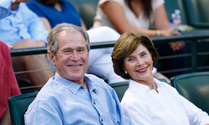 ARLINGTON, TX - SEPTEMBER 19:  Former U.S. president George W. Bush and former First Lady Laura Busy wait for the start of the game between the Seattle Mariners and the Texas Rangers at Globe Life Park in Arlington on September 19, 2015 in Arlington, Texas.  (Photo by Mike Stone/Getty Images)