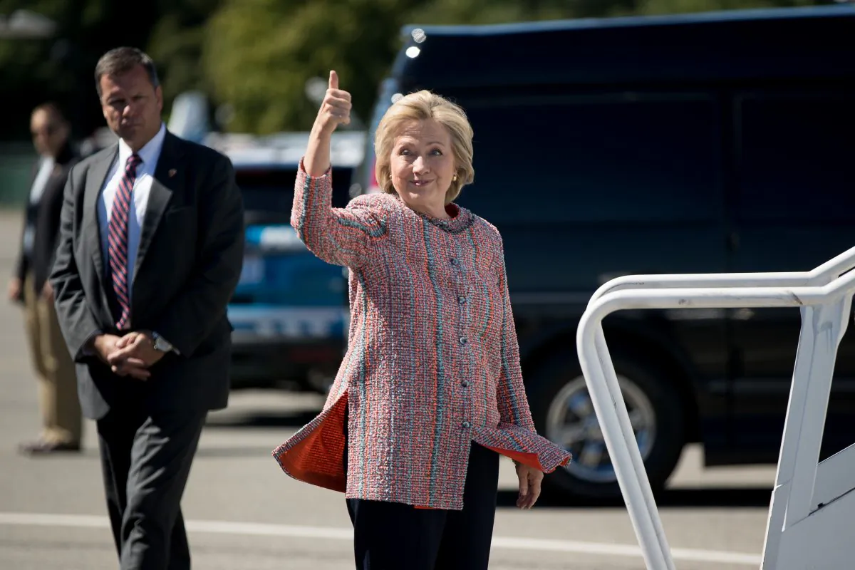 Democratic presidential candidate Hillary Clinton as she arrives to board her campaign plane at Westchester County Airport in White Plains, N.Y., Thursday, Sept. 15, 2016. (AP Photo/Andrew Harnik)