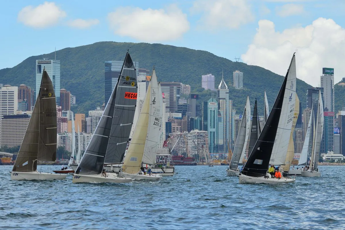 Sportsboats and J80’s set off on the 1st race of day 2 (Sunday Sept 11) of the RHKYC 2016 Autumn Regatta in Victoria Harbour,  Regatta winner in the Class R2B2 is leading the way followed by  the regatta No 2 boat Merlin. (Bill Cox/Epoch Times)