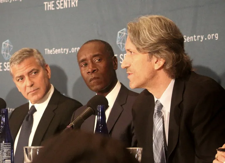 Actors George Clooney (L) and Don Cheadle (C) appear with author John Prendergast at the National Press Club, Sept. 14, to discuss the findings of a two-year investigation into the networks of corrupt South Sudan's senior officials. Clooney and Prendergast co-founded The Sentry and have an abiding interest in African issues. (Gary Feuerberg/Epoch Times)