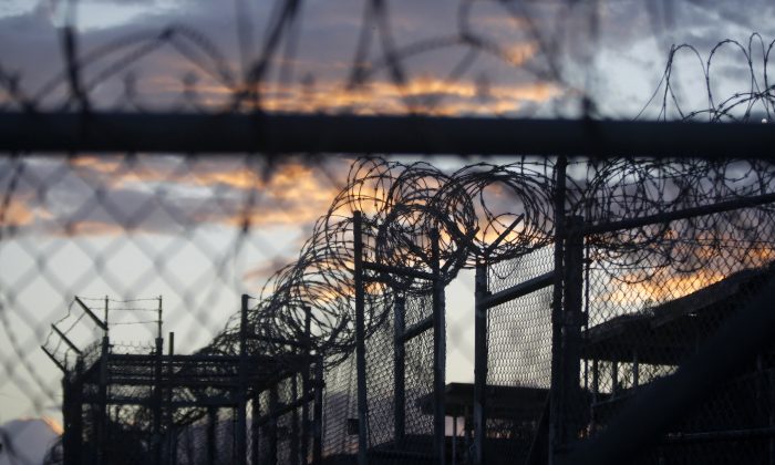 Dawn arrives at the now closed Camp X-Ray, which was used as the first detention facility for suspected al-Qaida and Taliban terrorists who were captured after the Sept. 11 attacks, at the Guantanamo Bay Naval Base, Cuba, on Nov. 21, 2013. (Charles Dharapak/AP Photo)
