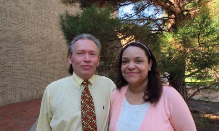 In a photo taken Sept. 9, 2016, William A. and Claire Rembis stand outside the Texas Tech University Law School in Lubbock, Texas. The couple is trying to regain custody of their 11 children after Texas child welfare officials took custody of them following allegations that include some of the children going into garbage bins to get scraps of food to eat. (AP Photo/Betsy Blaney)