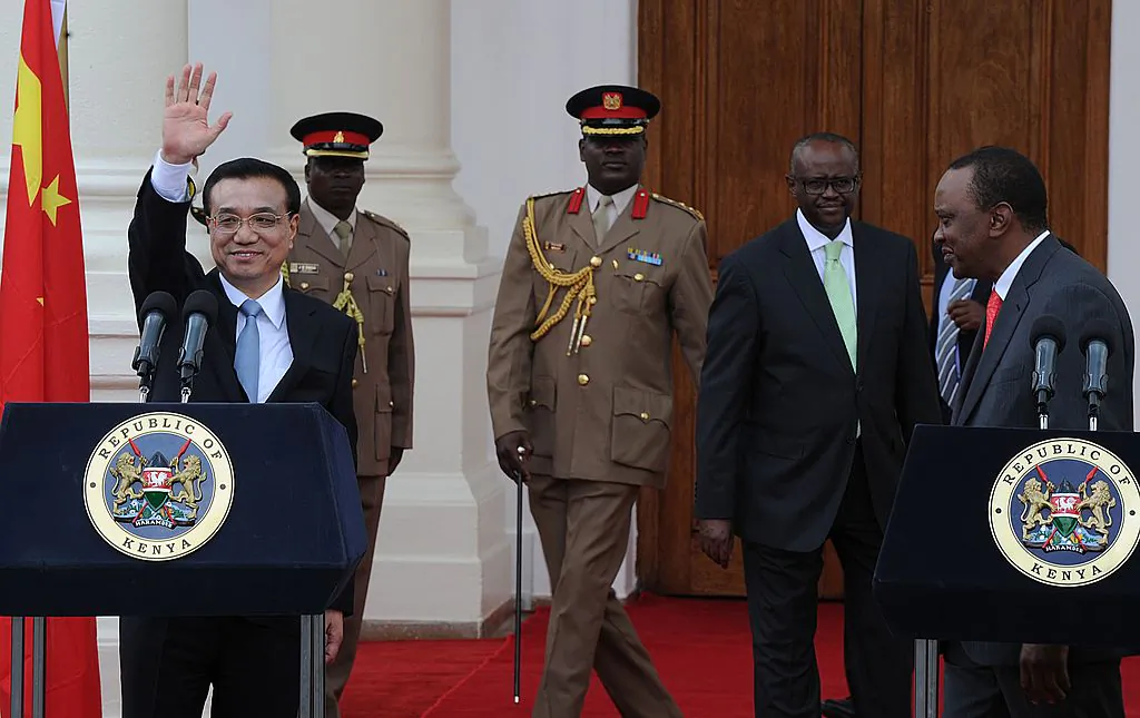 China's Premier, Li Keqiang (L) waves after giving a press conference with Kenyan President, Uhuru Kenyatta at State House in the capital Nairobi on May 10, 2014. (Tony Karumba/AFP/Getty Images)