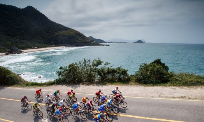 In this photo released by the IOC, cyclists compete in the men's road cycling race C4-5, during the Paralympic Games in Rio de Janeiro, Brazil, Saturday, Sept. 17, 2016. (Simon Bruty/OIS, IOC via AP)