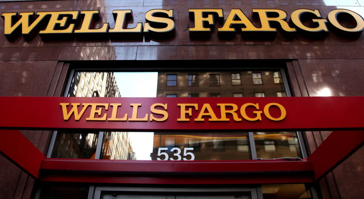 A Wells Fargo sign is displayed at a branch in New York in a file photo. (CX Matiash/AP Photo)