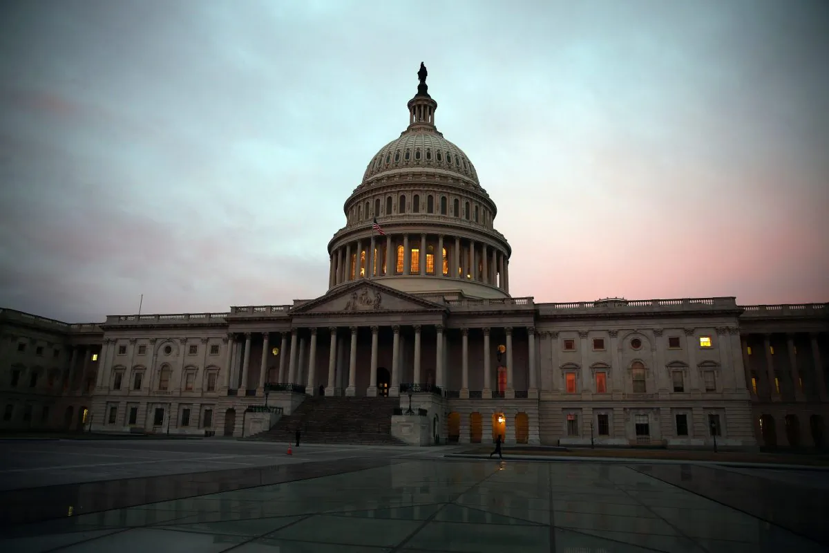 The morning sun begins to rise in front of the U.S. Capitol on March 11, 2014. (Mark Wilson/Getty Images)