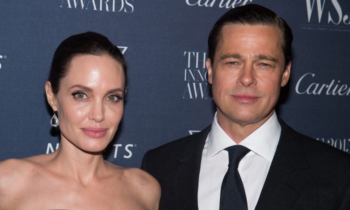 In this Nov. 4, 2015 file photo Angelina Jolie Pitt and Brad Pitt attend the WSJ Magazine Innovator Awards 2015 at The Museum of Modern Art in New York. Jolie and Pitt announced they are divorcing on Sept. 20. Pitt is reportedly under investigation for child abuse. (Photo by Charles Sykes/Invision/AP, File)