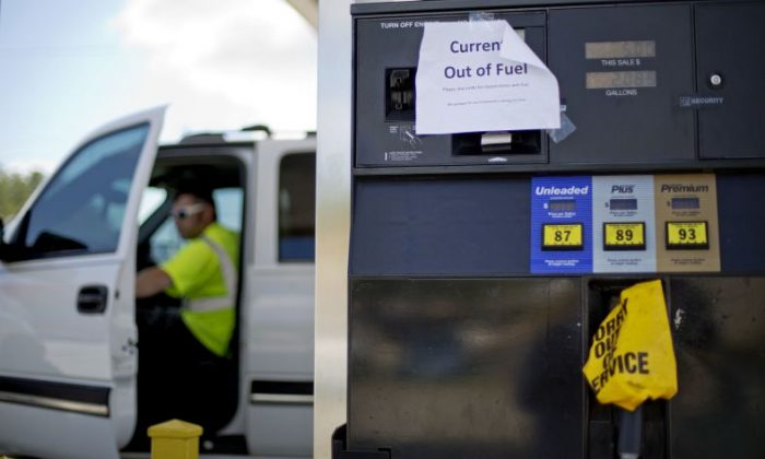 A sign informs customers of a gas outage at a station in Smyrna, Ga., Monday, Sept. 19, 2016. Gas prices spiked and drivers found "out of service" bags covering pumps as the gas shortage in the South rolled into the work week, raising fears that the disruptions could become more widespread. Georgia Gov. Nathan Deal issued an executive order Monday aimed at preventing price gouging. (AP Photo/David Goldman)