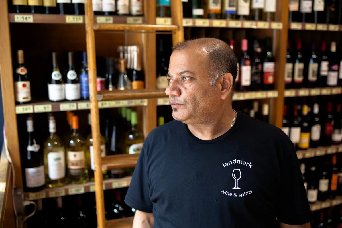 Binod Bhattarai, 51, assitant manager at Landmark Wine and Spirits on 23rd St. in Chelsea, Manhattan, New York, on Sept. 20, 2016. (Petr Svab/Epoch Times)