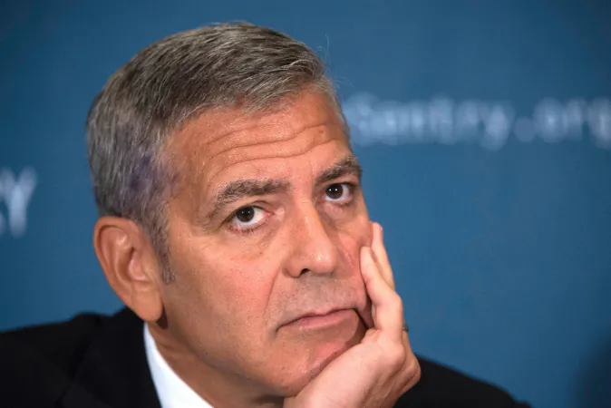 Actor George Clooney, human rights activist and co-founder of Sentry, speaks during a news conference on September 12, 2016, in Washington, DC, to present the report War Crimes Shouldnt Pay: Stopping the looting and destruction in South Sudan. Clooney is sad to hear about Angelina Jolie and Brad Pitt's impending divorce. (MOLLY RILEY/AFP/Getty Images)