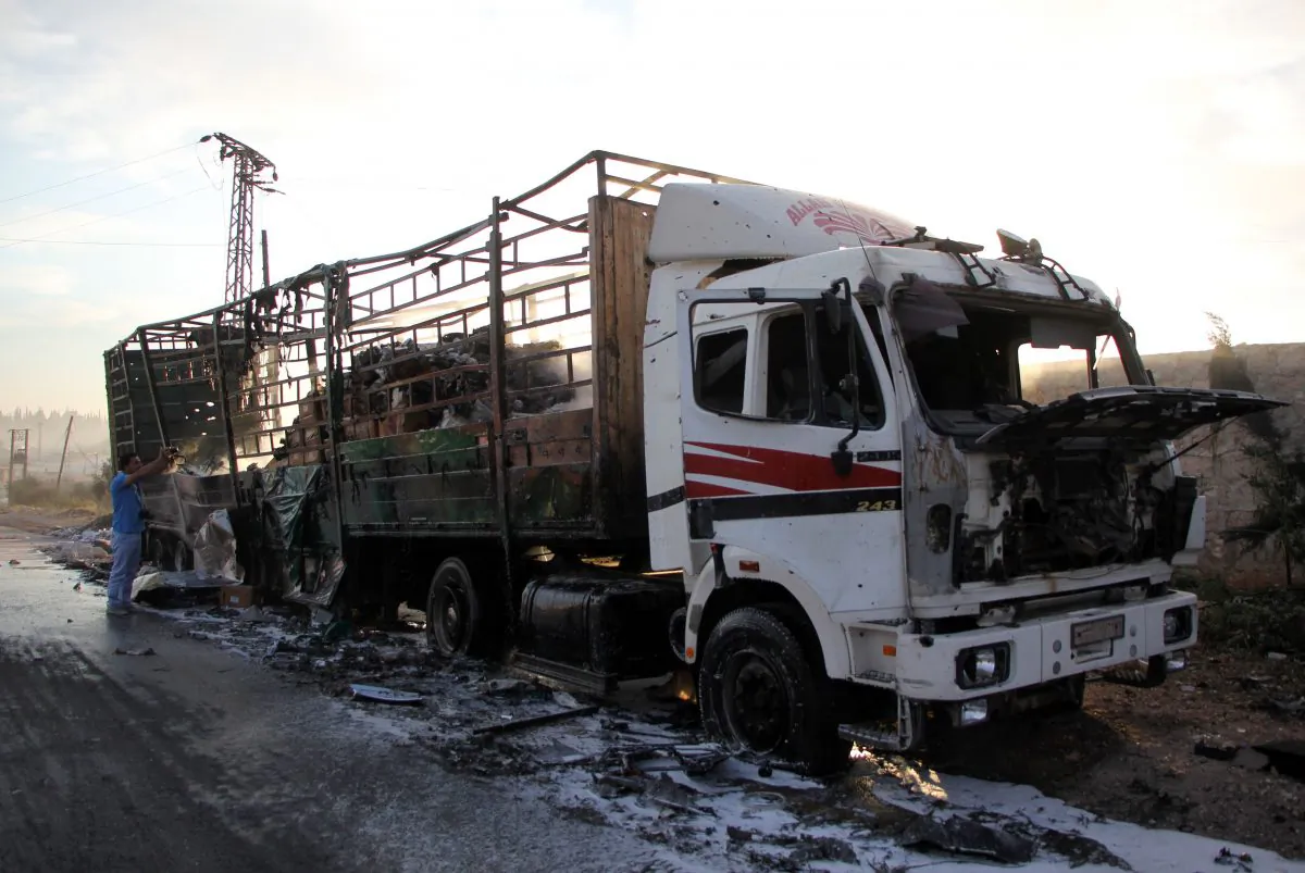 A humanitarian aid truck is destroyed following air strikes in the town of Orum al-Kubra on the western outskirts of Aleppo on Sept. 20, 2016, (OMAR HAJ KADOUR/AFP/Getty Images)