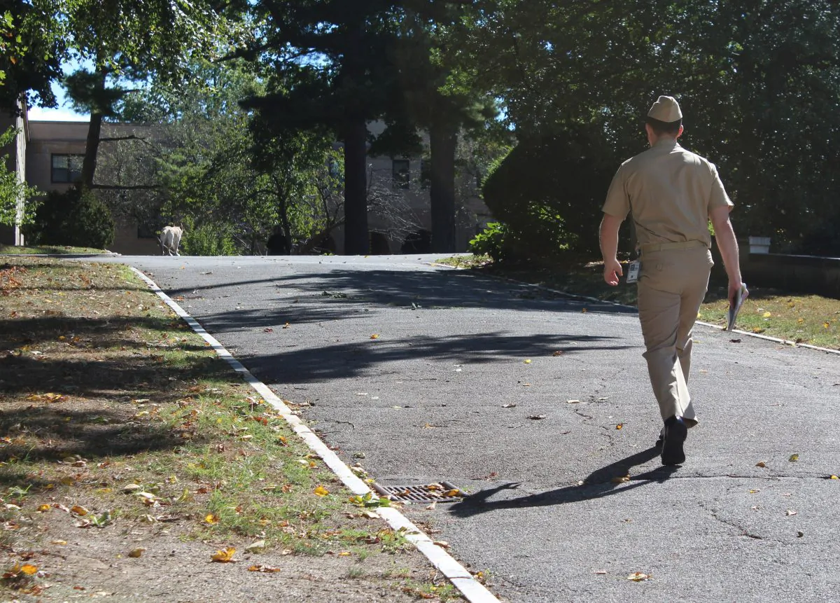 A midshipman walks across the campus of the U.S. Merchant Marine Academy in Kings Point, N.Y., on Sept. 15, 2016. (Frank Eltman/AP Photo)