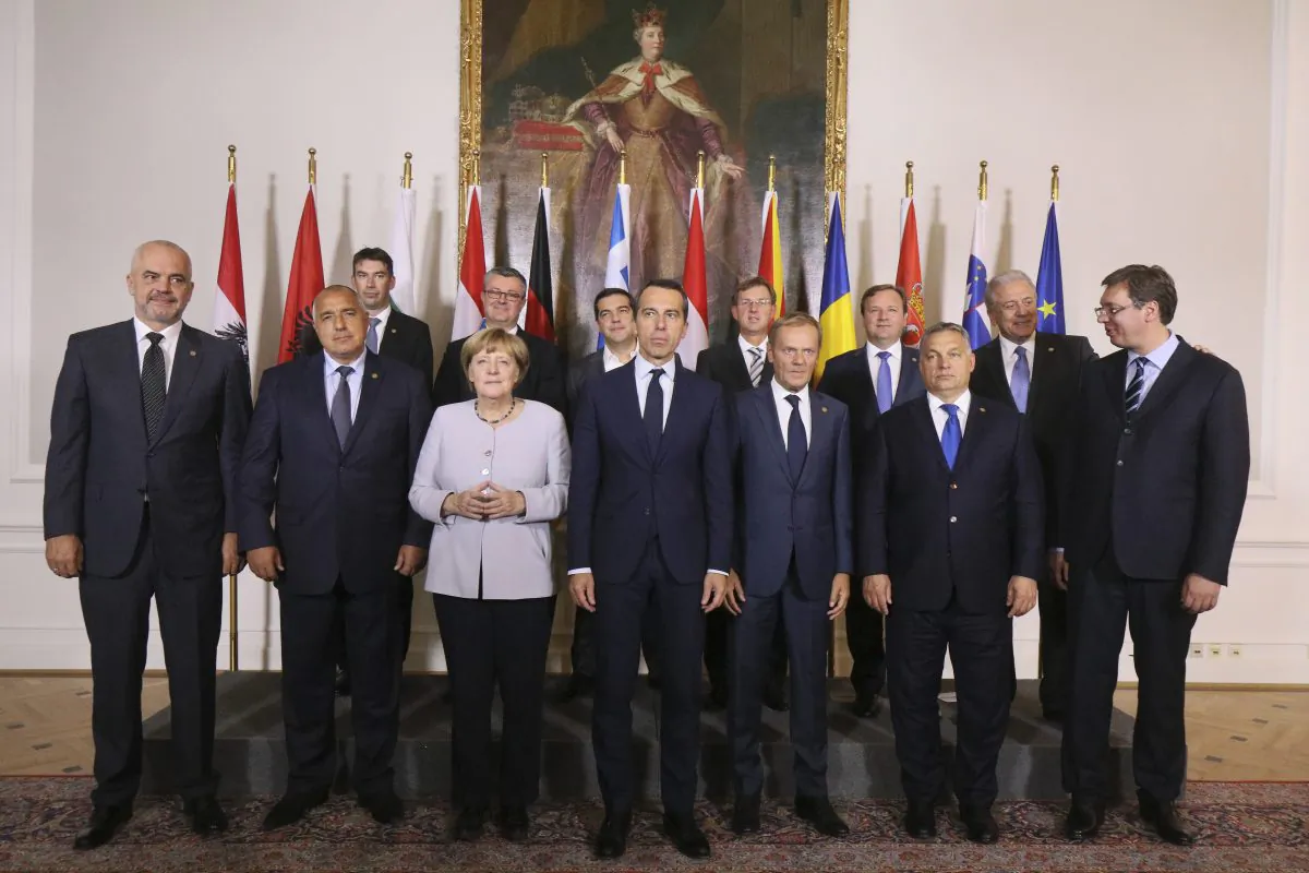 Austrian Chancellor Christian Kern (C) poses for a group after a meeting with his counterparts from Germany and West Balkans on strategies to deal with Europe's migrant crisis in Vienna, Austria, on Sept. 24, 2016. (AP Photo/Ronald Zak)
