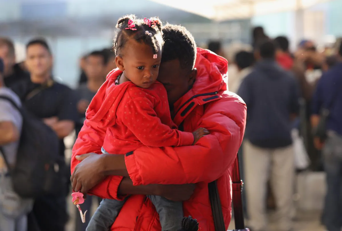 Haitian refugees await breakfast at an immigrant center in Tijuana, Mexico, on Sept. 24, 2016. In recent months a surge of Haitian refugees has arrived to Tijuana, seeking asylum at the border crossing into the United States. The center, called the Desayunador Salesiano Padre Chava, serves breakfast to more than 1,000 immigrants daily, many of them deportees from the United States. (John Moore/Getty Images)