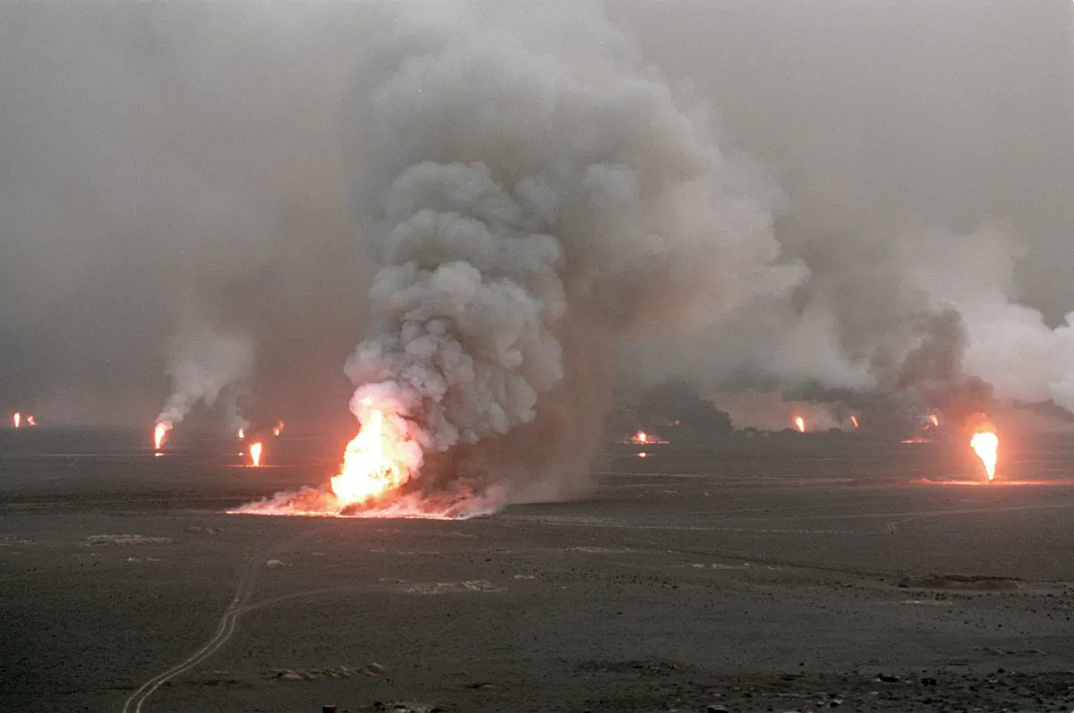 Several blown-out wells damaged by retreating Iraqi soldiers in Al-Ahmadi oil field burn in southern Kuwait on April 1, 1991. In 1991, Iraqi troops retreating after a seven-month occupation, smashed and torched 727 wells, badly polluting the atmosphere and creating crude oil lakes. In addition, up to eight billion barrels of oil were split into the sea by Iraqi forces damaging marine life and coastal areas up to 400 kilometers (250 miles) away. (Pascal Guyot/AFP/Getty Images)