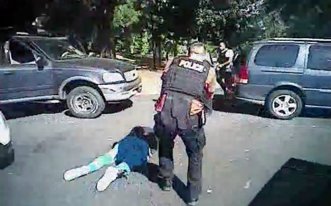 This image made from video provided by the Charlotte-Mecklenburg Police Department on Sept. 24, 2016 shows Keith Scott on the ground as police approach him in Charlotte, N.C., on Sept. 20, 2016. (Charlotte-Mecklenburg Police Department via AP)