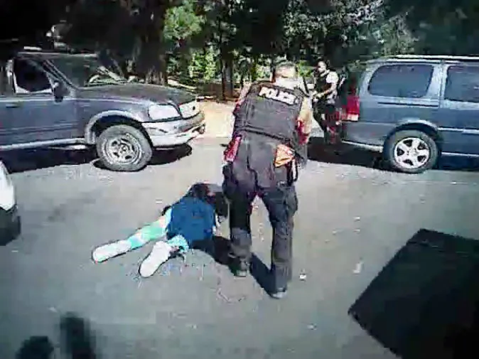 This image made from video provided by the Charlotte-Mecklenburg Police Department on Sept. 24, 2016 shows Keith Scott on the ground as police approach him in Charlotte, N.C., on Sept. 20, 2016. (Charlotte-Mecklenburg Police Department via AP)