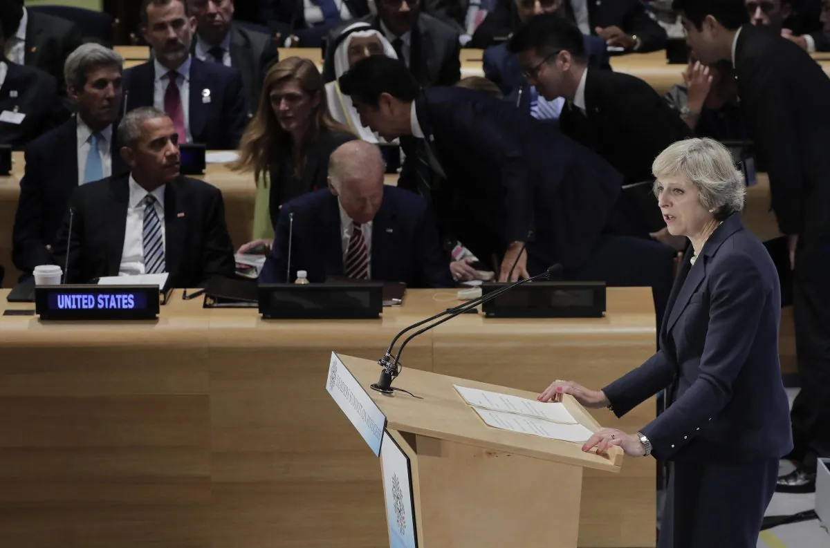 File-This Sept. 20, 2016, file photo shows British Prime Minister Theresa May, right, speaking at a Leader's Refugee Summit as U.S. President Barack Obama left, and Vice President Joe Biden, center, listen during the 71st session of the United Nations General Assembly, at U.N. headquarters. As for the "buzz" in U.N. corridors, it was two newcomers making their debuts on the international stage that captured the most attention: British Prime Minister Theresa May and Canadian Prime Minister Justin Trudeau. May assured the General Assembly that Britain will remain a global power and continue playing a role in trying to resolve the many challenges in the world despite its decision to leave the European Union. (AP Photo/Julie Jacobson, File)